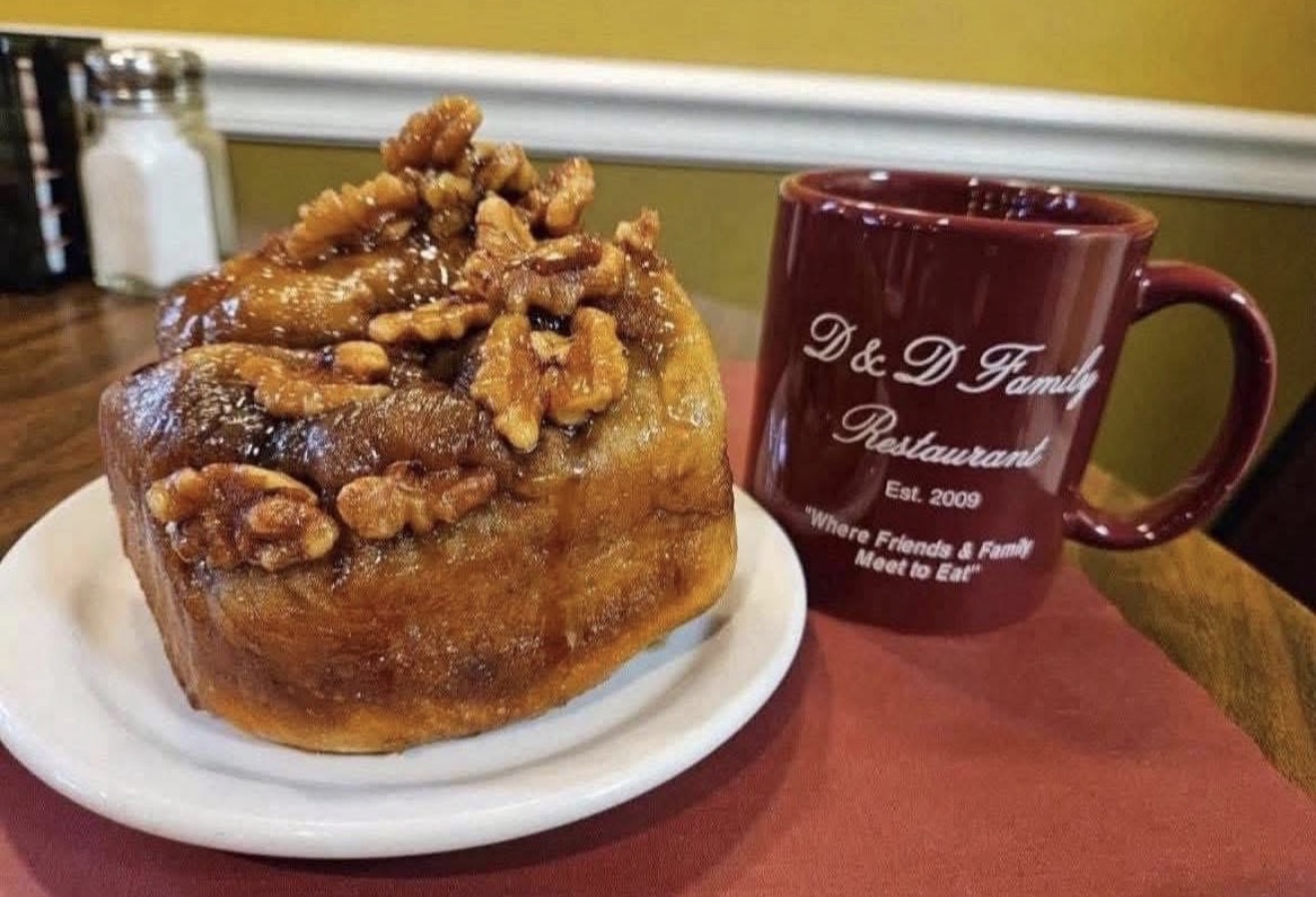 Signature walnut sticky bun with a D&D Family Restaurant coffee mug